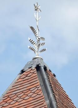 New turret with red blue blend tiles and stainless steel finial at the Argent Centre in Birmingham